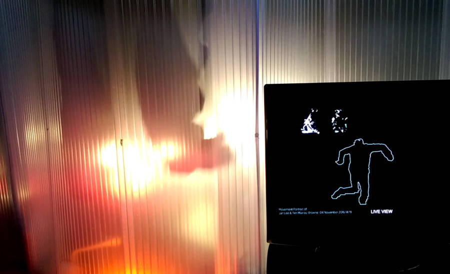 Movement Alphabet by Jan Lee and Tim Murray-Browne. At GAS Station London, audience view showing a live render of a participant experiencing the immersive performance within the interaction pod.